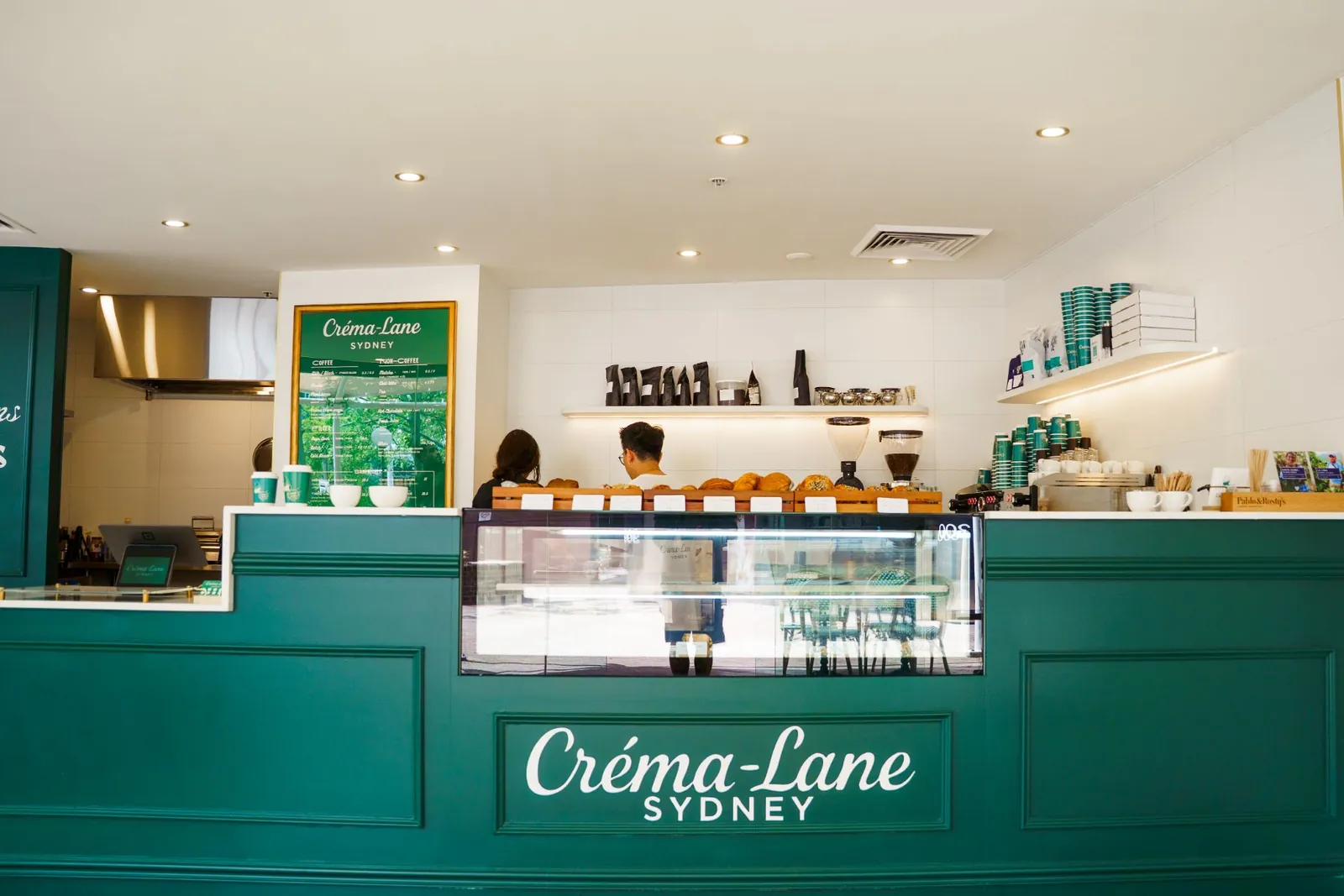 Créma-Lane café in Surry Hills: green panelled counter and pastry cabinet